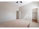 Bedroom with a double bed, ceiling fan, and walk-in closet at 1912 E Gemini Pl, Chandler, AZ 85249