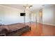 Spacious main bedroom with hardwood floors and access to the ensuite bathroom at 1912 E Gemini Pl, Chandler, AZ 85249
