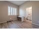 Cozy bedroom with wood-look floors, built-in desk, and access to a full bathroom at 1912 E Gemini Pl, Chandler, AZ 85249