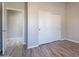 Spacious bedroom with wood-look floors and double-door closet at 1912 E Gemini Pl, Chandler, AZ 85249