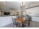 Kitchen with an island, breakfast nook, and views into the living room at 1912 E Gemini Pl, Chandler, AZ 85249