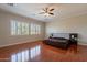 Large bedroom with hardwood floors, plantation shutters and a ceiling fan at 1912 E Gemini Pl, Chandler, AZ 85249