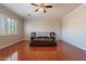 Bright and airy bedroom with hardwood floors, plantation shutters, and ceiling fan at 1912 E Gemini Pl, Chandler, AZ 85249