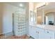 Elegant bathroom with a glass block shower and modern vanity at 1912 E Gemini Pl, Chandler, AZ 85249
