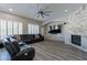 Relaxing living room with a stone fireplace and large sectional sofa at 1912 E Gemini Pl, Chandler, AZ 85249