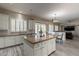 Open concept kitchen with island, granite countertops, and stainless steel appliances at 1912 E Gemini Pl, Chandler, AZ 85249