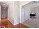 Long hallway with wood flooring and access to other rooms at 1912 E Gemini Pl, Chandler, AZ 85249