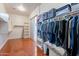 Large walk-in closet with custom shelving and hanging rods at 1912 E Gemini Pl, Chandler, AZ 85249