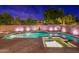 Stunning pool and spa at night with landscape lighting at 1912 E Gemini Pl, Chandler, AZ 85249
