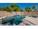 Inviting backyard pool with spa and waterfall feature at 1912 E Gemini Pl, Chandler, AZ 85249