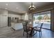 Bright kitchen with an island, breakfast nook, and access to the backyard at 1912 E Gemini Pl, Chandler, AZ 85249