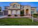 Stunning two-story home with a manicured lawn and brick pathway at 1912 E Gemini Pl, Chandler, AZ 85249
