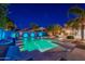 Stunning pool area at night with colorful lights at 1912 E Gemini Pl, Chandler, AZ 85249
