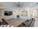 Open living room with a fireplace and large TV at 1912 E Gemini Pl, Chandler, AZ 85249