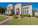 Beautiful two-story home with lush landscaping and a welcoming entry at 1912 E Gemini Pl, Chandler, AZ 85249