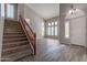 Spacious entryway with tile flooring, wooden staircase, and high ceilings at 1912 E Gemini Pl, Chandler, AZ 85249