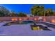 Backyard pool at twilight with dramatic lighting at 1912 E Gemini Pl, Chandler, AZ 85249