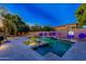 Evening view of a luxurious pool and spa area at 1912 E Gemini Pl, Chandler, AZ 85249