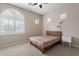 Bright bedroom with a wooden bed frame and large window at 1912 E Gemini Pl, Chandler, AZ 85249