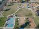 Aerial view of a park with basketball court, playground, and open green space at 4505 W Mclellan Rd, Glendale, AZ 85301
