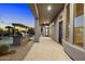 Outdoor kitchen and covered patio with built-in grill, adjacent to pool at 34599 N 99Th Way, Scottsdale, AZ 85262