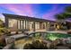 Relaxing pool and spa area with rock waterfall feature and desert landscaping at 34599 N 99Th Way, Scottsdale, AZ 85262