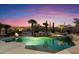 Inviting pool and spa surrounded by desert landscaping with mountain views at 34599 N 99Th Way, Scottsdale, AZ 85262