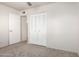Simple bedroom with double door closet and carpet at 6742 N 43Rd Ave, Glendale, AZ 85301
