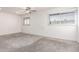 Spacious bedroom with two windows and ceiling fan at 6742 N 43Rd Ave, Glendale, AZ 85301