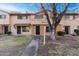 Brick townhome with a well-maintained lawn and walkway at 6742 N 43Rd Ave, Glendale, AZ 85301