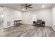 Bright living room with gray chair and wood-look floors at 6742 N 43Rd Ave, Glendale, AZ 85301