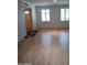 Hardwood floors and an open living area with views of the entryway at 3114 E Hazelwood St, Phoenix, AZ 85016