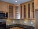 Modern kitchen with wood cabinets, granite countertops, and stainless steel appliances at 3114 E Hazelwood St, Phoenix, AZ 85016