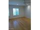 Bedroom featuring hardwood floors, plantation shutters, and ceiling fan at 3114 E Hazelwood St, Phoenix, AZ 85016