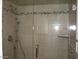 Large shower with glass enclosure and stone accents at 3114 E Hazelwood St, Phoenix, AZ 85016
