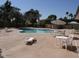 Community pool with lounge chairs and tables at 3114 E Hazelwood St, Phoenix, AZ 85016