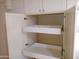 White kitchen pantry with two pull-out drawers for extra storage at 3114 E Hazelwood St, Phoenix, AZ 85016