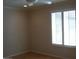 Bedroom with hardwood floors and window with shutters at 3114 E Hazelwood St, Phoenix, AZ 85016