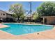 Community swimming pool with a large deck at 6742 N 43Rd Ave, Glendale, AZ 85301