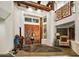 Spacious entryway with high ceilings, exposed beams, and unique stone flooring at 8599 E Tecolote Cir, Scottsdale, AZ 85266