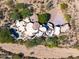 Aerial view of a unique home with a large pool and desert landscaping at 8599 E Tecolote Cir, Scottsdale, AZ 85266