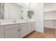 Double vanity bathroom with white cabinets and quartz countertops at 7010 E Drygulch Rd, San Tan Valley, AZ 85143