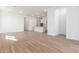 Open concept living room with wood-look tile floors and kitchen island at 7010 E Drygulch Rd, San Tan Valley, AZ 85143
