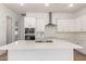 Modern kitchen with white cabinets, quartz countertops, and stainless steel appliances at 7010 E Drygulch Rd, San Tan Valley, AZ 85143