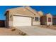 Tan house with white garage door and red shutters at 7010 E Drygulch Rd, San Tan Valley, AZ 85143
