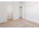 Bedroom with carpet, access to closet and hallway at 7010 E Drygulch Rd, San Tan Valley, AZ 85143