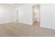 Spacious bedroom with neutral carpeting and access to bathroom at 7010 E Drygulch Rd, San Tan Valley, AZ 85143