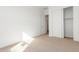 Bright bedroom with neutral carpeting and sliding closet doors at 7010 E Drygulch Rd, San Tan Valley, AZ 85143