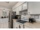 Kitchen boasts stainless steel appliances and white cabinetry at 3017 W Hearn Rd, Phoenix, AZ 85053