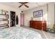 Bedroom with queen bed, dresser, and built-in shelving at 3017 W Hearn Rd, Phoenix, AZ 85053